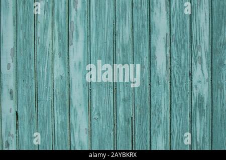 Old weathered grunge green painted wooden boards wall closeup as background Stock Photo