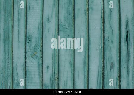 Old weathered grunge green painted wooden boards wall closeup as background Stock Photo