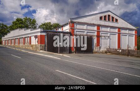 The old factory building on the street Stock Photo