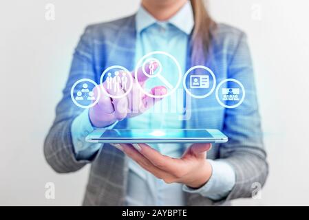 Apply now Hiring or employee needed concept with business woman using a tablet computer. Lady front presenting hand blue glow co Stock Photo