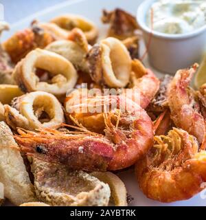 Mixed deep-fried fish, shrimp and squid platter Stock Photo