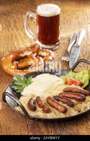 Traditional German Sausages with Mashed Potato and Sauerkraut. Wurst or ...