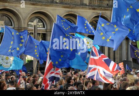 a crowd of protesters waving flags at the leeds for europe anti brexit demonstration Stock Photo