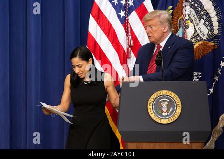 Daria Ortiz, the granddaughter of 92 year old Maria Fuertes, who was raped and murdered in New York, is escorted off stage by United States President Donald J. Trump after delivering remarks to National Border Patrol Council Members in the South Court Auditorium of the White House in Washington, DC, U.S. on Friday, February 14, 2020. Credit: Stefani Reynolds/CNP /MediaPunch Stock Photo