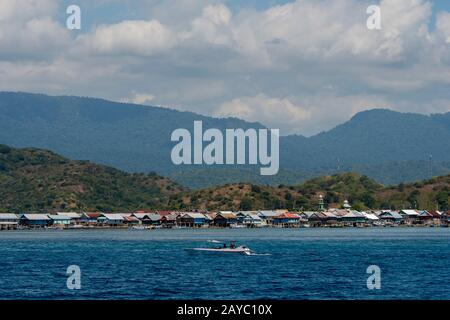 View of Bungin Island, off the coast of Sumbawa Island, Indonesia, home to a group of Bajau Sea Gypsies, famous for living in stilt houses above the w Stock Photo