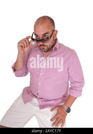 Middle age Hispanic man sitting in the studio Stock Photo