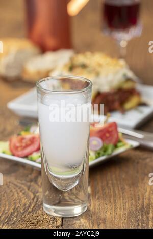 Greek salad with moussaka on wood Stock Photo