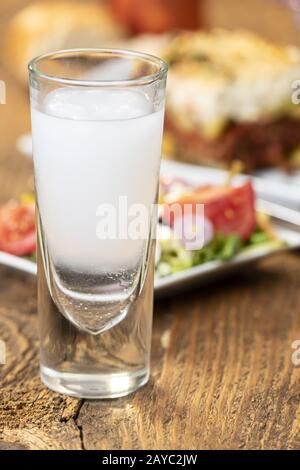 Greek salad with moussaka on wood Stock Photo