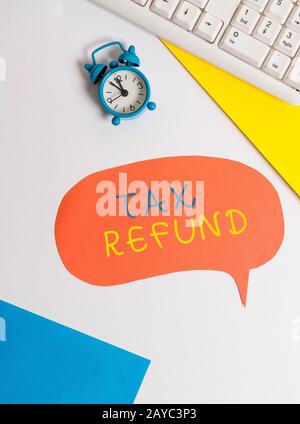 Handwriting text writing Tax Refund. Concept meaning refund on tax when the tax liability is less than the tax paid Flat lay wit Stock Photo
