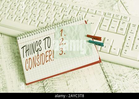 Text sign showing Things To Consider. Conceptual photo think about something carefully in order to make decision notebook paper Stock Photo