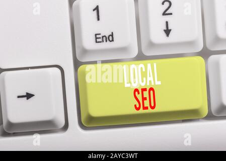 Writing note showing Local Seo. Business photo showcasing helps businesses promote products and services to local customers Whit Stock Photo