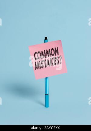 Handwriting text Common Mistakes Question. Concept meaning repeat act or judgement misguided making something wrong Ballpoint bl Stock Photo