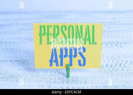 Text sign showing Personal Apps. Conceptual photo Organizer Online Calendar Private Information Data Green clothespin white wood Stock Photo
