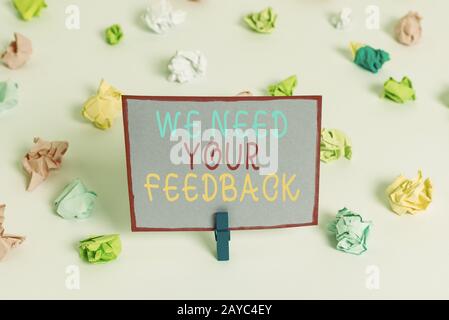 Writing note showing We Need Your Feedback. Business photo showcasing criticism given to say can be done improvement Colored cru Stock Photo