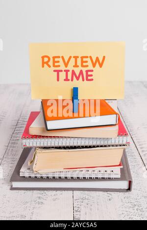 Conceptual hand writing showing Review Time. Business photo text to think or talk about something again Set schedule to review p Stock Photo
