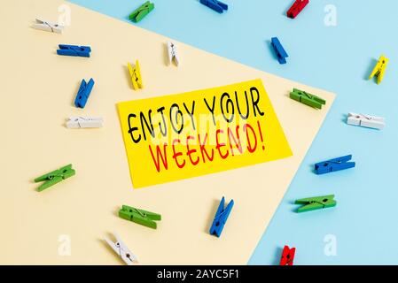 Text sign showing Enjoy Your Weekend. Conceptual photo wishing someone that something nice will happen at holiday Colored clothe Stock Photo