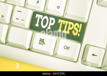 Word writing text Top Tips. Business concept for small but particularly useful piece of practical advice White pc keyboard with Stock Photo