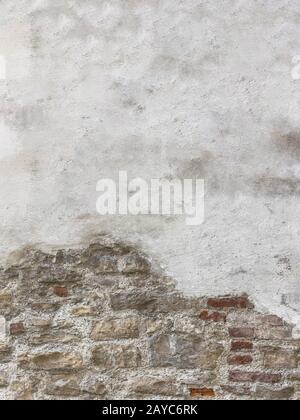 Partially newly plastered brick wall Stock Photo