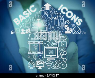 Writing note showing Basic Icons. Business photo showcasing pictogram or ideogram displayed on a computer screen or phone Male w Stock Photo