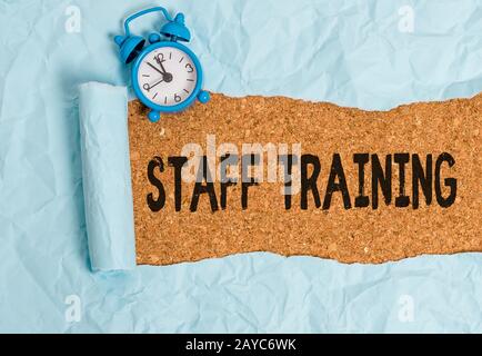 Handwriting text writing Staff Training. Concept meaning program that helps employees learn specific knowledge. Stock Photo
