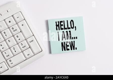Word writing text Hello I Am New. Business concept for introducing oneself in a group as fresh worker or student White pc keyboa Stock Photo
