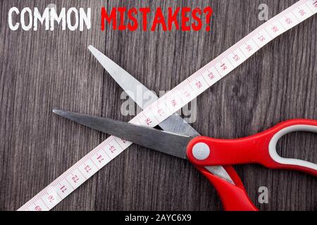 Word writing text Common Mistakes Question. Business concept for repeat act or judgement misguided making something wrong Front Stock Photo