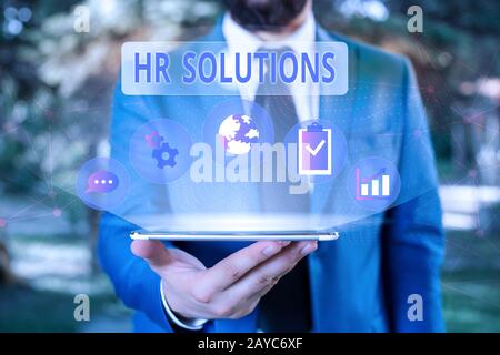 Handwriting text Hr Solutions. Concept meaning Outsourced Huanalysis resources consultancy and support Experts Male human wear f Stock Photo