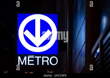 Montreal Quebec Canada January 22 2020: Montreal metro sign, at night reflecting light indicating a subway station, this distinctive logo of Montreal Stock Photo