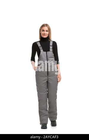 Woman in gray working overalls shot Stock Photo