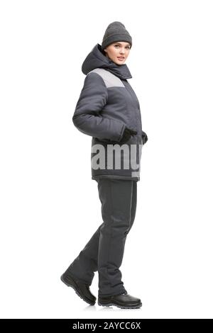 Female in gray working clothes and cap view Stock Photo