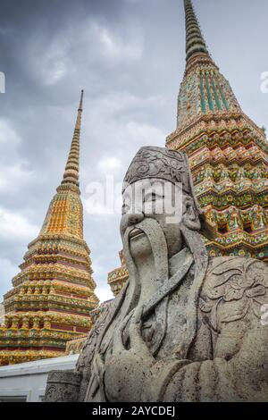 Chinese Guard statue in Wat Pho, Bangkok, Thailand Stock Photo