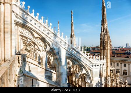 White statue on top of Duomo cathedral Stock Photo