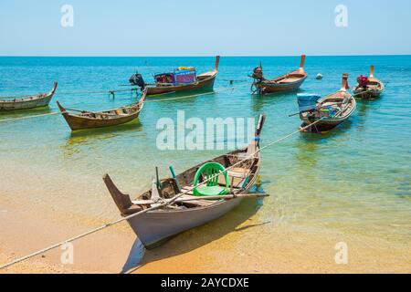 Traditional wooden boats moored at sand beach Stock Photo