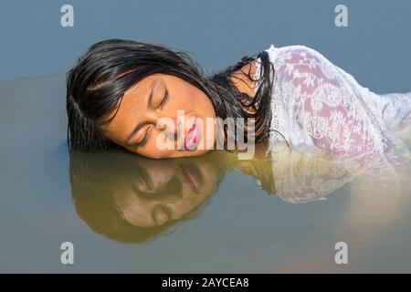 Portrait female face reflection in water Stock Photo