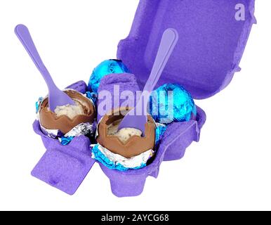 Carton of cream filled chocolate eggs isolated on a white background Stock Photo