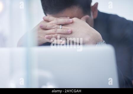 Stressed asian man or businessman at office Stock Photo