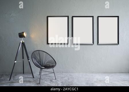 Modern living room with three empty picture frames Stock Photo