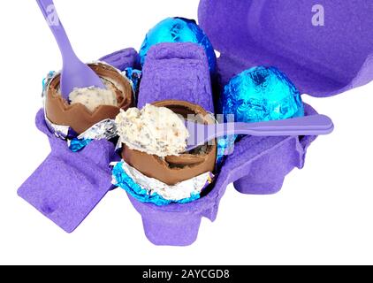 Carton of cream filled chocolate eggs isolated on a white background Stock Photo
