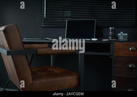 Work space on black table of a photographer or designer with laptop Stock Photo