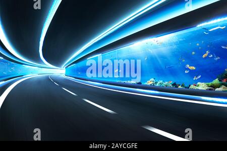 Abstract blurred speed motion road in glass tunnel underwater Stock Photo