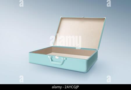 Open empty retro vintage mint blue suitcase isolated on light blue background . Stock Photo