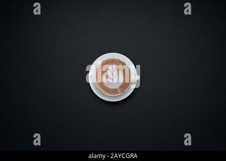 Coffee cup isolated on black background . Flat lay and top view with copy space . Stock Photo