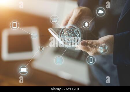 Man holding smart phone making online shopping and banking payment. Blurred background . Stock Photo