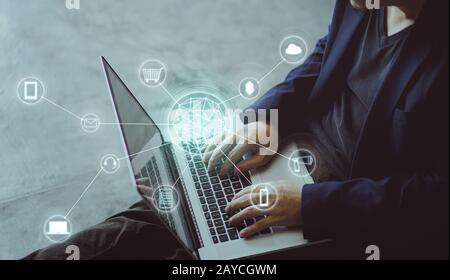 Top angle and closeup view  of businessman using the laptop making online shopping and banking payment. Blurred background . Stock Photo