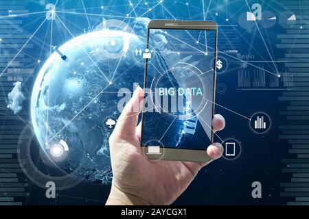 Man using digital device with BIG DATA word on digital virtual screen . Hi-tech business concept . Stock Photo