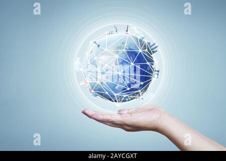 Businessman holding planet Earth in palm. Elements of this image are furnished by NASA Stock Photo