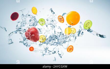 Water splash with various fruits isolated on white background Stock Photo