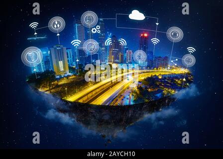 Fantasy island floating in the air with smart city and wireless communication network Stock Photo