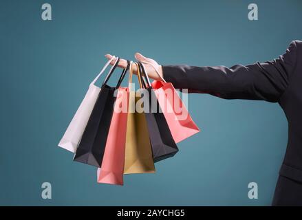 Close up of man hand with shopping bags Stock Photo