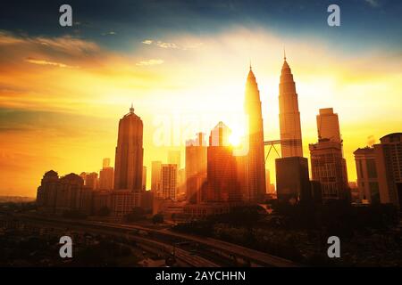 Sunrise in Kuala Lumpur with the silhouette of the Kuala Lumpur city ...